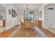 Charming dining room featuring a chandelier, table for four, and a window that provides ample natural light at 3071 Alice Ln., Little River, SC 29566