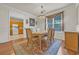 Charming dining room featuring a chandelier, table for four, and a window that provides ample natural light at 3071 Alice Ln., Little River, SC 29566