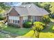 Beautiful brick home with mature landscaping and a well-manicured lawn at 3071 Alice Ln., Little River, SC 29566