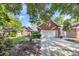 Charming brick home with a well-maintained lawn, lush landscaping, and a two-car garage at 3071 Alice Ln., Little River, SC 29566