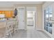 View of kitchen featuring the pantry, island with barstool seating and adjoining laundry room at 3071 Alice Ln., Little River, SC 29566