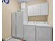 Well lit laundry room with washer, dryer and refrigerator with ample storage at 3071 Alice Ln., Little River, SC 29566
