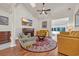 Inviting living room with a fireplace, vaulted ceilings, ceiling fan, comfortable seating, and hardwood floors at 3071 Alice Ln., Little River, SC 29566