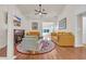 Cozy living room with a fireplace, vaulted ceilings, ceiling fan, comfortable seating, and hardwood floors at 3071 Alice Ln., Little River, SC 29566
