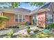 Charming brick patio featuring potted plants, a blue chair and sliding glass doors at 3071 Alice Ln., Little River, SC 29566