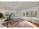 Sun room featuring lots of natural light, wood floors and a comfy sitting area at 3071 Alice Ln., Little River, SC 29566