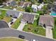 Aerial view of home with a well-kept lawn in a neighborhood with mature trees and well-maintained landscaping at 309 Rycola Circle, Surfside Beach, SC 29575