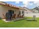 Nice backyard featuring an awning-covered patio with a grill, and outdoor seating perfect for entertaining at 309 Rycola Circle, Surfside Beach, SC 29575