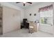 Bright bedroom with built-in Murphy bed, ceiling fan, window, desk, and office chair at 309 Rycola Circle, Surfside Beach, SC 29575