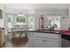 Bright dining area with large windows, decorative valances, and view from the kitchen sink at 309 Rycola Circle, Surfside Beach, SC 29575