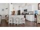 Kitchen features a stone breakfast bar and stainless steel appliances, open to the main living area at 309 Rycola Circle, Surfside Beach, SC 29575