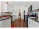 Spacious kitchen with stainless appliances, stone countertops, and pantry for ample storage at 309 Rycola Circle, Surfside Beach, SC 29575
