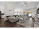 Comfortable living room with stylish furnishings, a ceiling fan, and a seamless flow to the dining area at 309 Rycola Circle, Surfside Beach, SC 29575