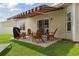 Charming patio area with retractable awning, comfortable seating, and a well-maintained yard at 309 Rycola Circle, Surfside Beach, SC 29575