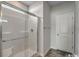 Modern bathroom featuring glass-enclosed shower with tiled walls and a tiled floor at 319 Garden Grove St, Conway, SC 29526