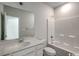 Bathroom featuring a combination tub and shower, white cabinets, and a large mirror at 319 Garden Grove St, Conway, SC 29526