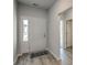 Inviting foyer featuring modern flooring, natural light, and a view into the rest of the home at 319 Garden Grove St, Conway, SC 29526