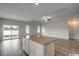 Open-concept kitchen with granite countertops, and modern appliances creating a great space for entertaining at 319 Garden Grove St, Conway, SC 29526