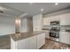 Modern kitchen with stainless steel appliances, granite countertops, and an island, perfect for entertaining at 319 Garden Grove St, Conway, SC 29526