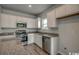 Modern kitchen featuring granite countertops, stainless steel appliances, and ample cabinet space at 319 Garden Grove St, Conway, SC 29526