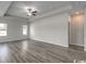 Large main bedroom with a tray ceiling, modern flooring and neutral paint providing a serene space at 319 Garden Grove St, Conway, SC 29526