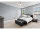 Cozy bedroom featuring neutral carpet, ceiling fan, and natural light at 323 Waties Dr., Murrells Inlet, SC 29576