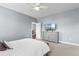 Clean bedroom with neutral carpet, ceiling fan, and grey dresser at 323 Waties Dr., Murrells Inlet, SC 29576