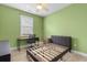 Green bedroom with desk and window at 323 Waties Dr., Murrells Inlet, SC 29576