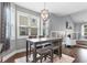 Cozy dining area with modern chandelier, comfortable seating, and view of the fireplace and TV at 323 Waties Dr., Murrells Inlet, SC 29576