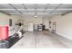 Spacious garage with ample storage space, equipped for a home gym, includes epoxy flooring at 323 Waties Dr., Murrells Inlet, SC 29576