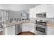 Bright kitchen with granite countertops, stainless steel appliances, and view to living room at 323 Waties Dr., Murrells Inlet, SC 29576