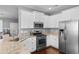 Spacious kitchen featuring stainless appliances, granite countertops, and white cabinets at 323 Waties Dr., Murrells Inlet, SC 29576