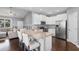 Modern kitchen with granite countertops, stainless steel appliances, and an island with bar seating at 323 Waties Dr., Murrells Inlet, SC 29576