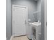 Functional laundry room includes a modern washer and dryer, tile flooring, and convenient storage shelving at 323 Waties Dr., Murrells Inlet, SC 29576