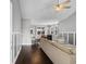 Open-concept living space with hardwood floors, neutral tones, and a view into the dining area at 323 Waties Dr., Murrells Inlet, SC 29576