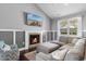 Stylish living room featuring a cozy fireplace, modern decor, and plenty of natural light at 323 Waties Dr., Murrells Inlet, SC 29576