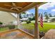 Cozy porch featuring a ceiling fan, and a view of the well-maintained front yard at 323 Waties Dr., Murrells Inlet, SC 29576