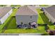 Aerial view of a well-maintained home with a spacious backyard, patio, and a privacy fence at 348 Hidden Cove Dr., Little River, SC 29566