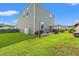 Well maintained backyard with a patio, grill, privacy plants, and a neatly cut lawn at 348 Hidden Cove Dr., Little River, SC 29566