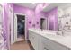 Lavender bathroom with a double vanity, large mirror, and separate room for storage at 348 Hidden Cove Dr., Little River, SC 29566