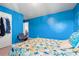 Blue bedroom displaying a Starfish themed comforter set, and an adjacent doorway at 348 Hidden Cove Dr., Little River, SC 29566