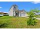 Attractive two-story home with a two-car garage and a well-maintained lawn at 348 Hidden Cove Dr., Little River, SC 29566