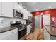 Modern kitchen with stainless steel appliances, granite countertops, and white cabinetry at 348 Hidden Cove Dr., Little River, SC 29566
