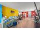 Open-concept living space with colorful walls, wooden floors, and connected kitchen and dining areas at 348 Hidden Cove Dr., Little River, SC 29566