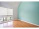 Peaceful bedroom with laminate floors, neutral walls, and a window providing natural light and privacy at 351 Lake Arrowhead Rd. # 24-396, Myrtle Beach, SC 29572