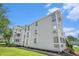 Corner exterior view of the multi-story building with multiple balconies, landscaping at 351 Lake Arrowhead Rd. # 24-396, Myrtle Beach, SC 29572