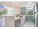 Stylish kitchen with stainless steel appliances, a breakfast bar, and a sunny view from the adjacent living area at 351 Lake Arrowhead Rd. # 24-396, Myrtle Beach, SC 29572