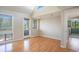 Bright living room featuring hardwood floors, natural light, and a glass door to the outside deck at 351 Lake Arrowhead Rd. # 24-396, Myrtle Beach, SC 29572