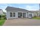 Exterior view of a backyard featuring a concrete patio and string lights at 3620 Diamond Stars Way, Little River, SC 29566