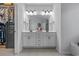 Bathroom featuring double vanity sinks, a large mirror, and lots of cabinet space at 3620 Diamond Stars Way, Little River, SC 29566